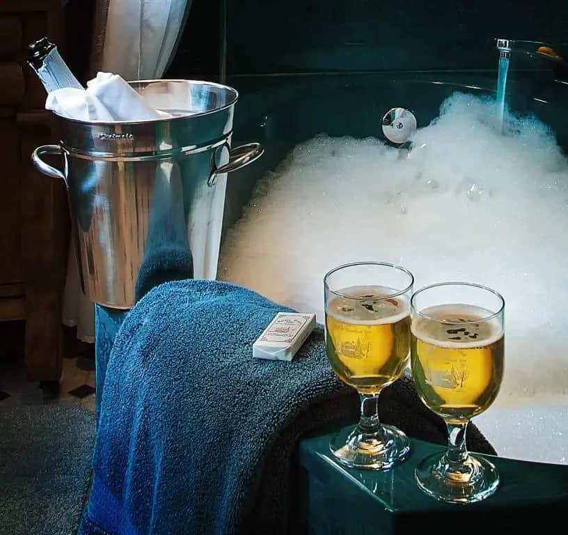 Private in-room jacuzzi tub in the Deluxe Queen Suite at Holden House 1902 Bed & Breakfast Inn