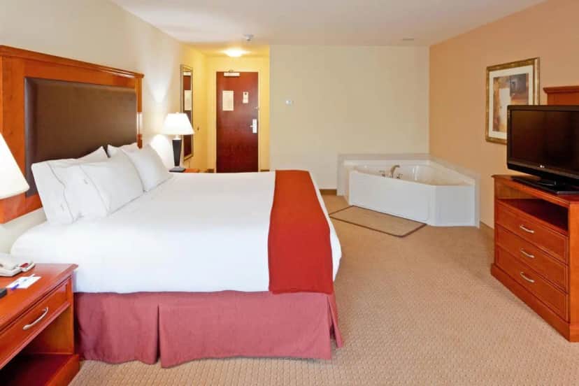 Private in-room jacuzzi tub in the King Room with Jetted Tub at Holiday Inn Express & Suites Albany Airport Area - Latham