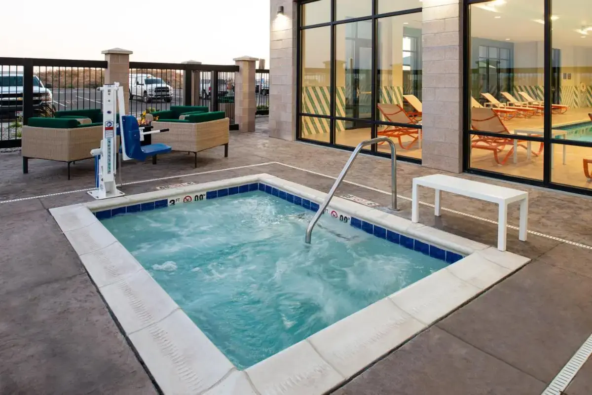 a large swimming pool in the middle of a building at Holiday Inn & Suites - Idaho Falls by IHG in Idaho Falls