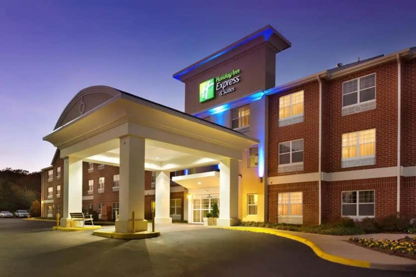 a hotel building with a gazebo in front of it at Holiday Inn Express & Suites Manassas by IHG in Manassas