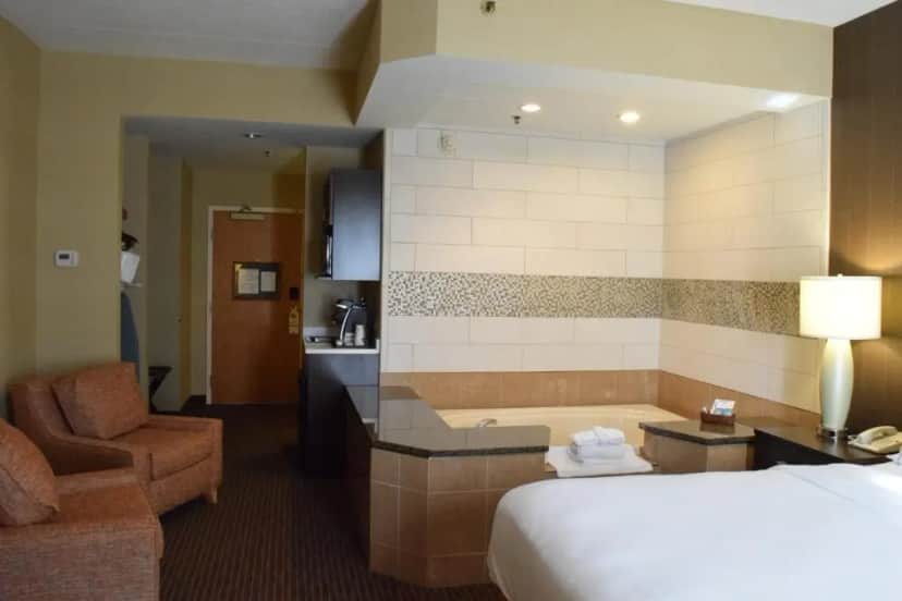 Private in-room jacuzzi tub in the King Room with Jetted Tub at Holiday Inn Express & Suites Watertown-thousand Islands By IHG