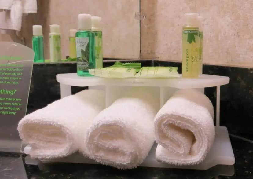 a white shelf with towels on it in a bathroom at Holiday Inn Express Hotel & Suites Nogales by IHG in Nogales