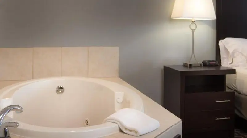 In-room hot tub at Holiday Inn Express Le Claire Riverfront-Davenport, an IHG hotel in Le Claire, IA