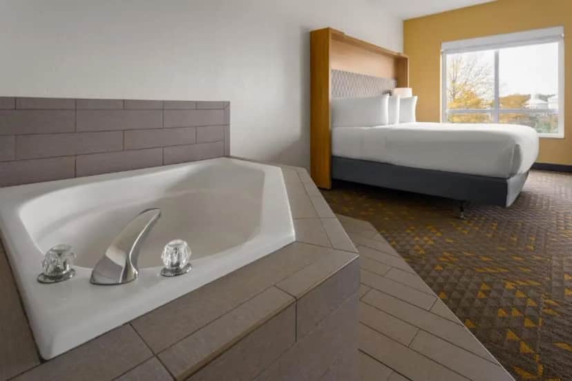 Private in-room jacuzzi tub in the King Room with Jetted Tub at Holiday Inn Pearl - Jackson Area By IHG