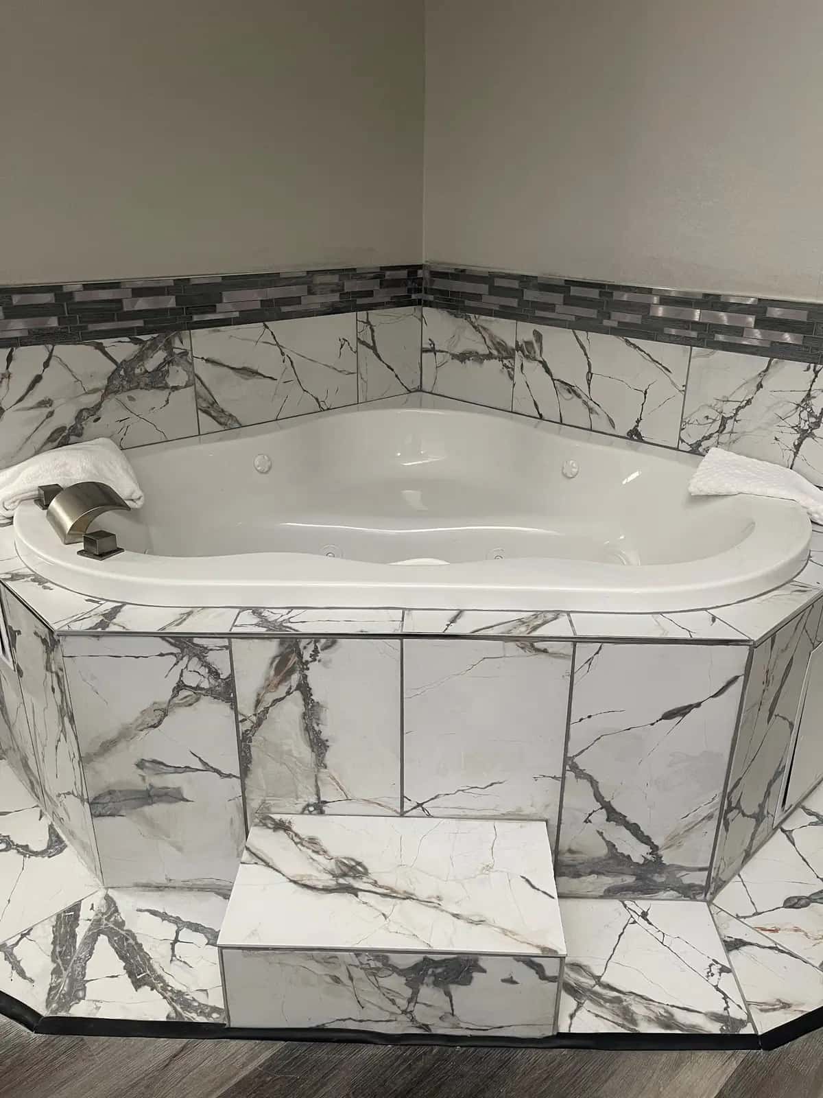 Private in-room jacuzzi tub at HomeTown Inn & Suites