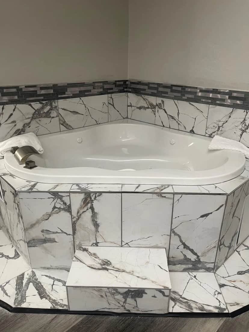 Private in-room jacuzzi tub at HomeTown Inn & Suites