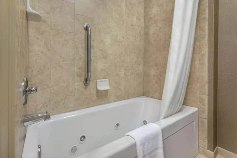 Private in-room jacuzzi tub in the One-Bedroom King Suite with Whirlpool - Non-Smoking at Homewood Suites by Hilton Fort Smith