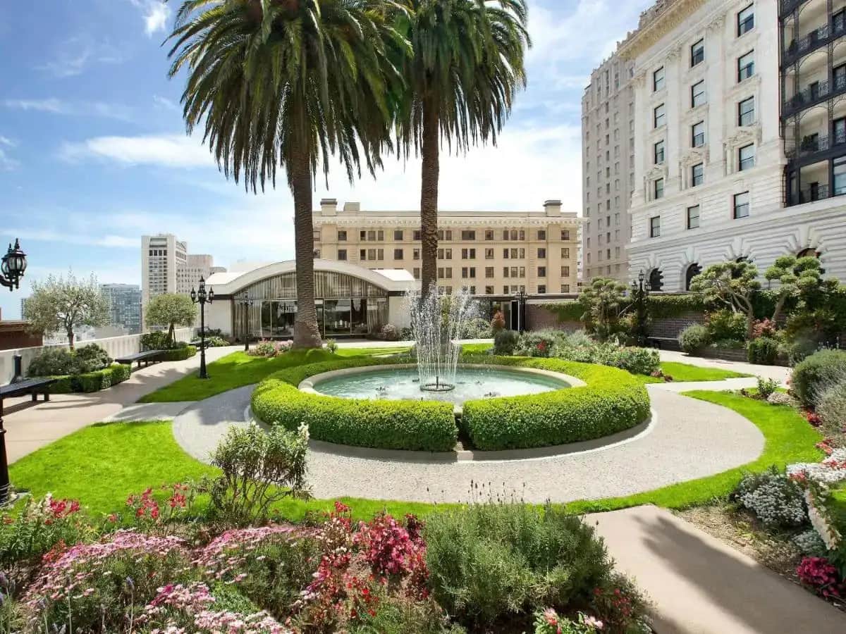 a fountain in a garden in front of a building at Fairmont San Francisco in San Francisco
