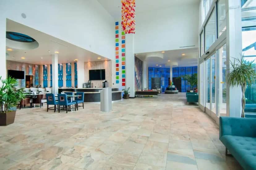 an office with a lobby with chairs and a table at Hotel Indigo Waco by IHG in Waco