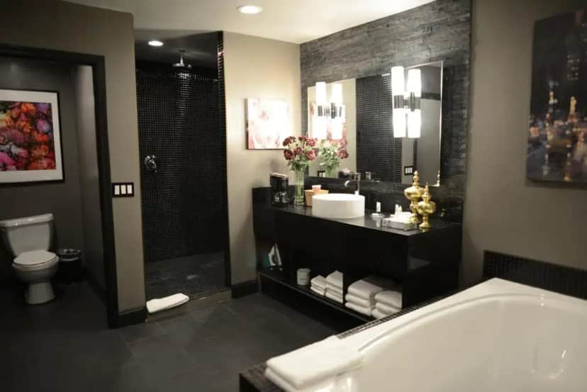 a bathroom with a tub and a shower and a toilet at Hotel Le Reve Pasadena in Pasadena