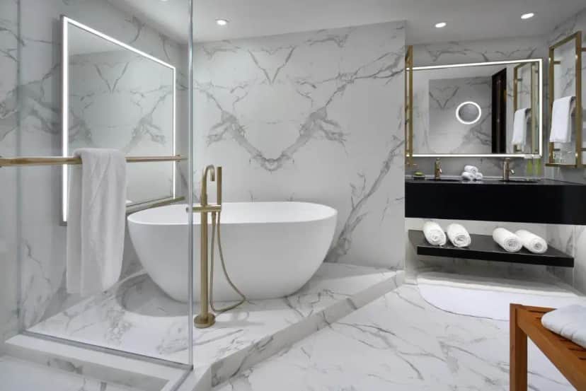 a white bathroom with a tub and a sink at Hotel Washington in Washington, D.C.