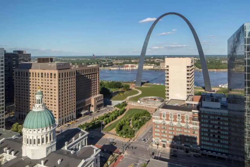 an aerial view of a city with the gateway arch at Hyatt Regency Saint Louis at The Arch in Saint Louis