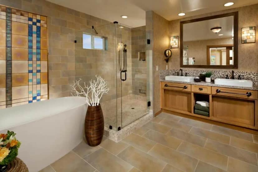 a bathroom with a tub and a sink and a mirror at Hyatt Vacation Club at the Welk, San Diego in Lawrence Welk Resort Village