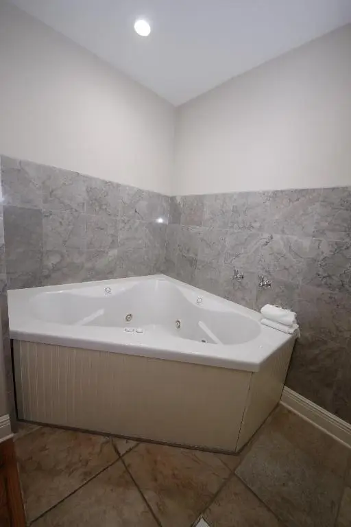 Private in-room jacuzzi tub in the King Suite with Spa Bath at Hyde Park Hotel