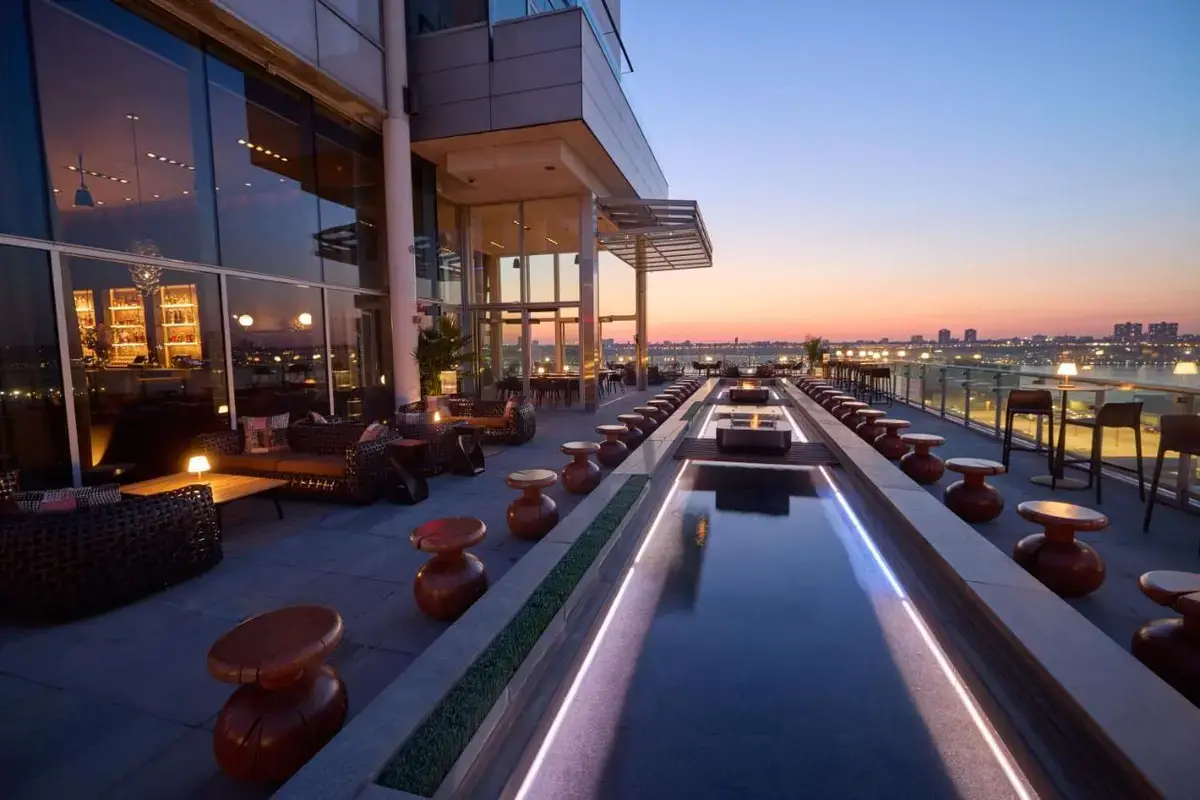 a building with a pool on top of it at Ink 48 Hotel in New York