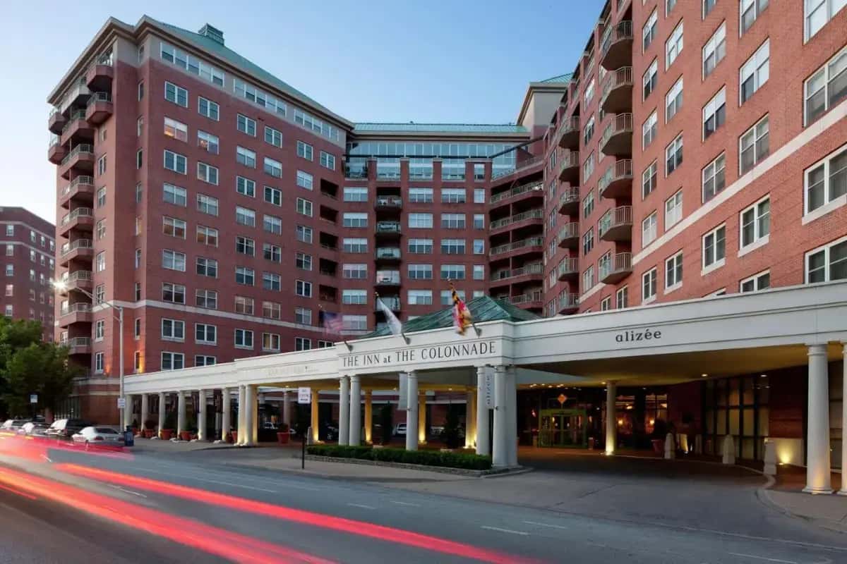 a building on the corner of a street with buildings at Inn at the Colonnade Baltimore - A DoubleTree by Hilton Hotel in Baltimore