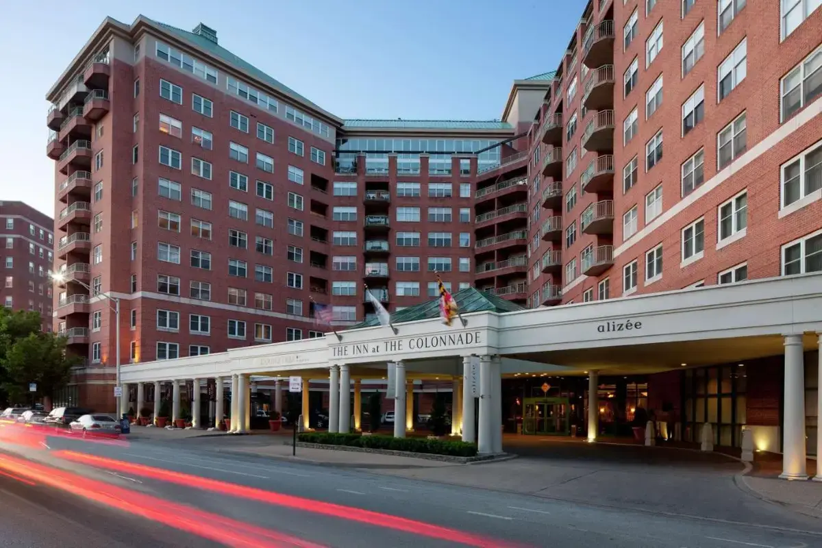 a building on the corner of a street with buildings at Inn at the Colonnade Baltimore - A DoubleTree by Hilton Hotel in Baltimore