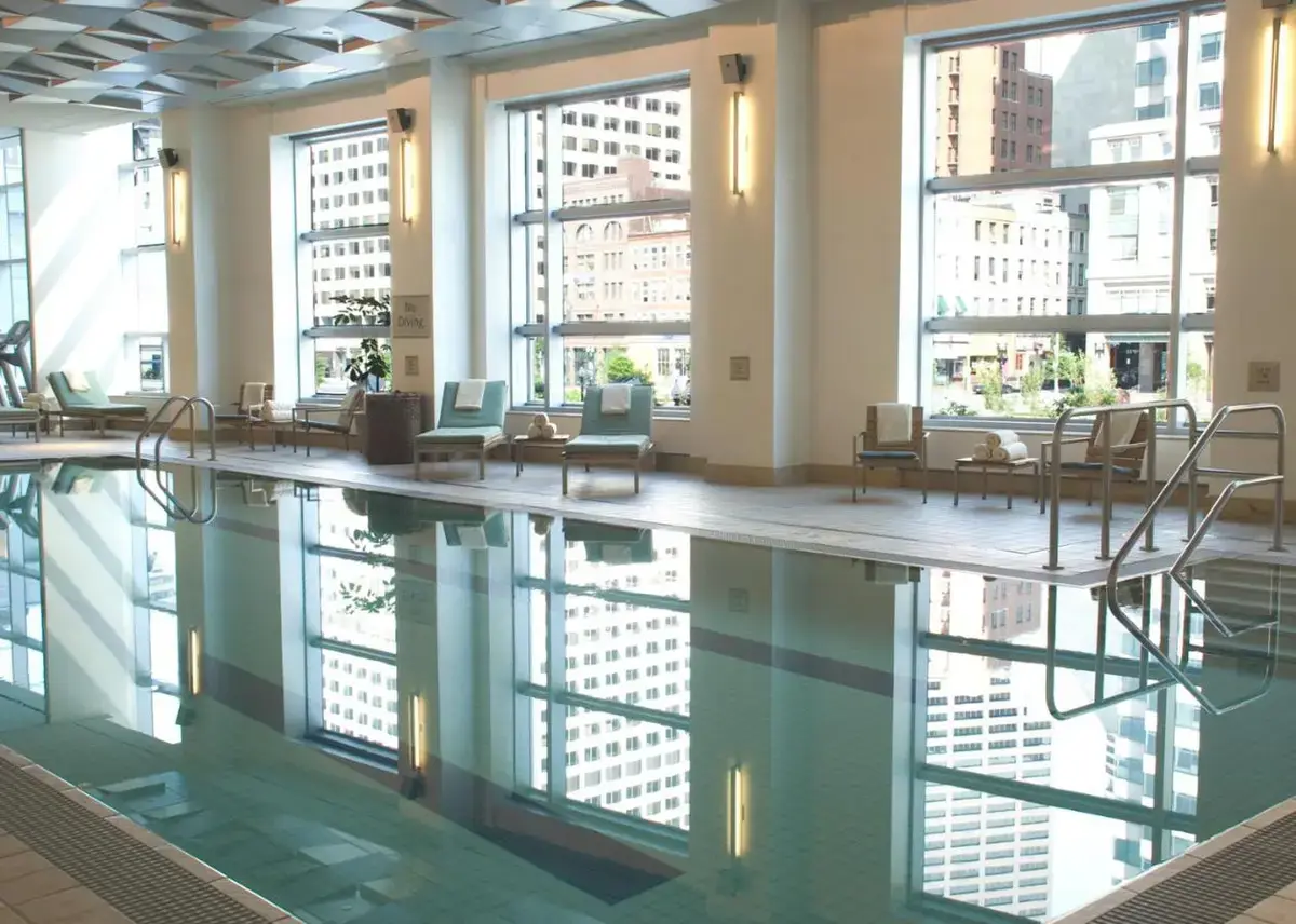 a pool in the lobby of a building with windows at InterContinental Boston by IHG in Boston