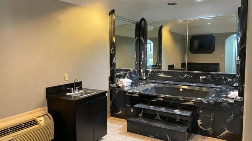 Private in-room jacuzzi tub in the King Suite with Spa Bath at Island Suites Hobby Airport