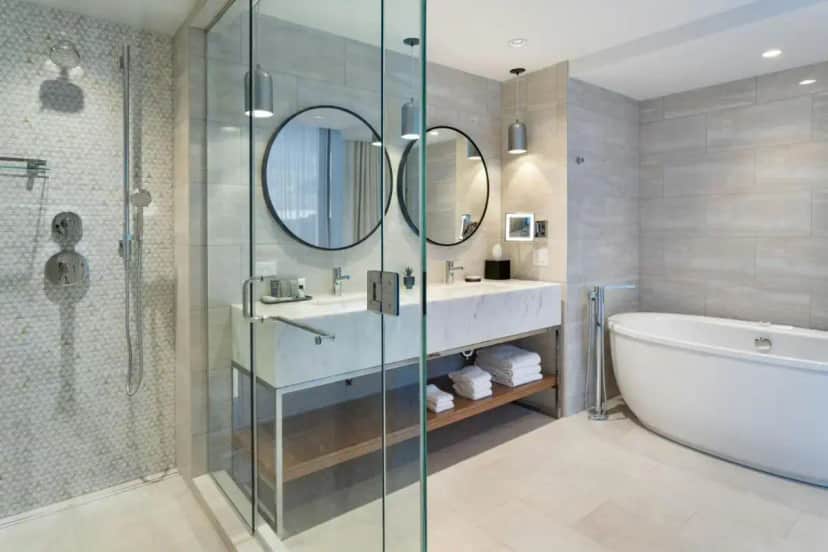 a bathroom with a tub and a sink and a shower at JW Marriott Tampa Water Street in Tampa