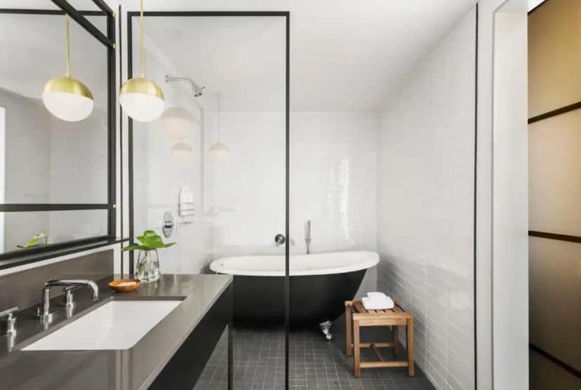 a bathroom with a tub and a sink at Kimpton Everly Hotel Hollywood by IHG in Los Angeles