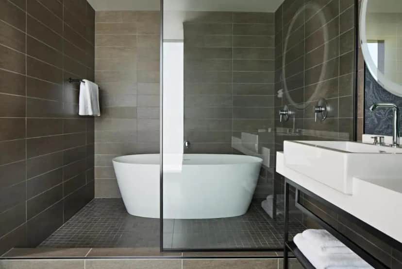 a bathroom with a tub and a sink at Kimpton Sawyer Hotel by IHG in Sacramento
