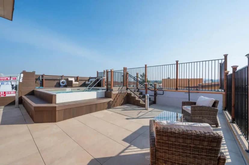 a patio with a hot tub and a swimming pool at King Bed-Walk Downtown-Free Garage Parking-Laundry in Walnut Creek