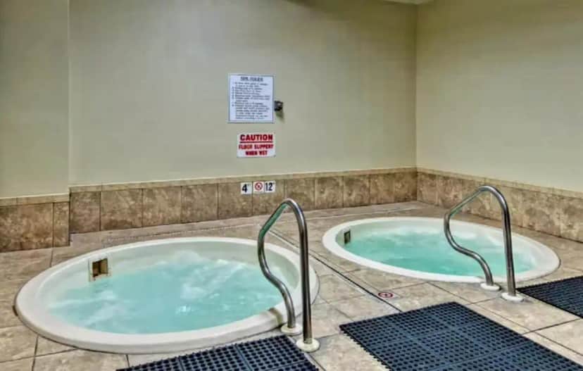 a jacuzzi tub with two handles in a bathroom