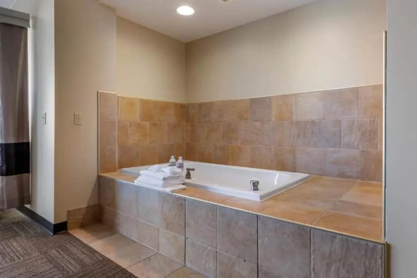 Private in-room jacuzzi tub in the King Suite with Lake View - Non-Smoking at Lift Bridge Lodge, Ascend Hotel Collection