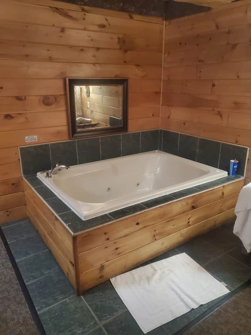 Private in-room jacuzzi tub at Log Cabin Lodge and Suites