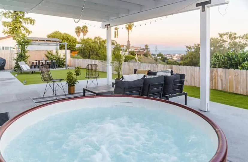 a hot tub on the patio of a house at Luxury House - Awesome Views - 15m from DT & beaches in San Diego