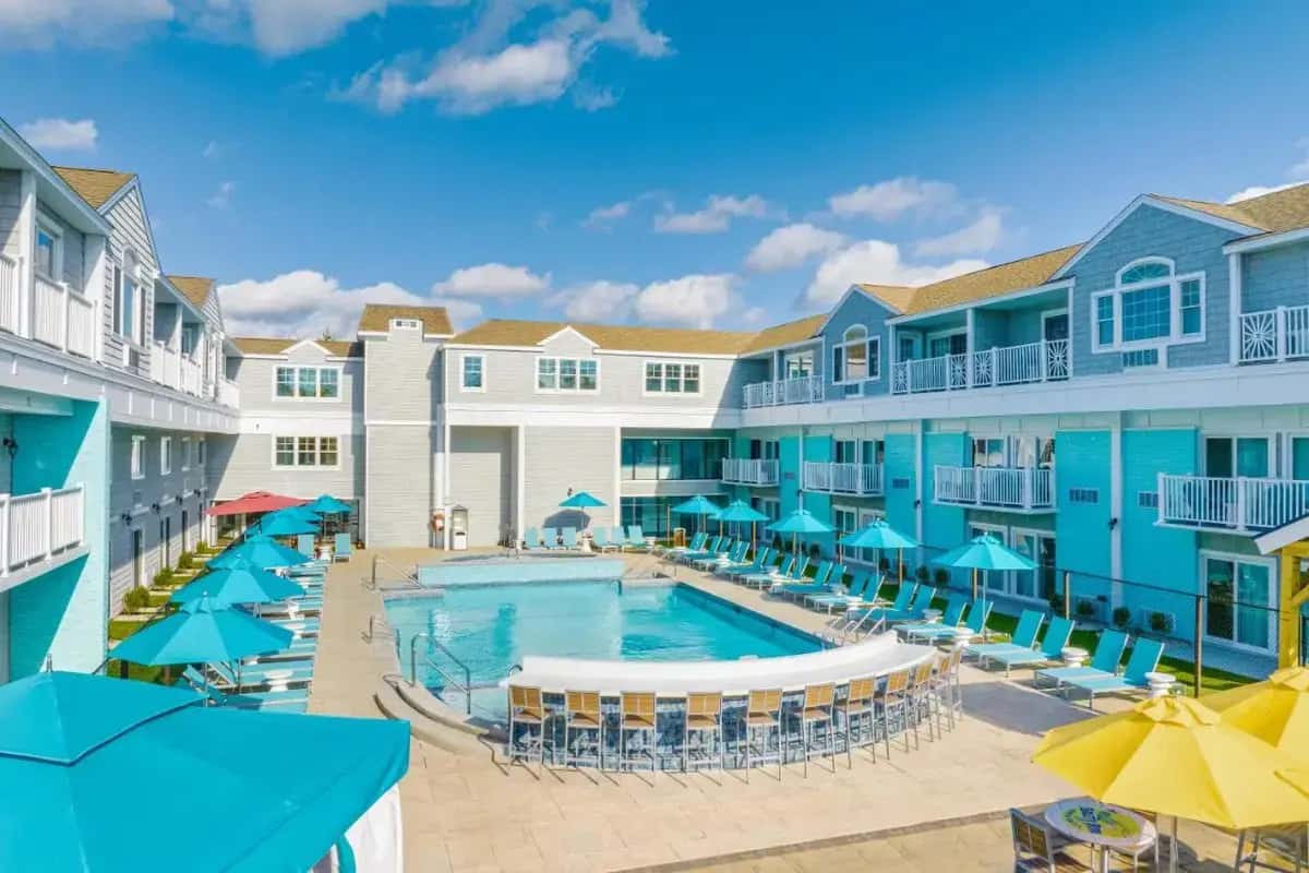 an image of a pool at a resort with chairs and umbrellas at Margaritaville Resort Cape Cod in Hyannis