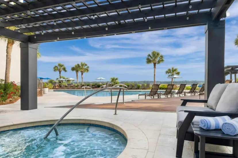 a swimming pool with a hot tub in a patio at Marriott's Harbour Point and Sunset Pointe at Shelter Cove in Hilton Head Island
