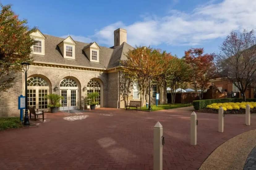 a large house with a brick driveway in front of it at Marriott's Manor Club at Ford's Colony in Williamsburg