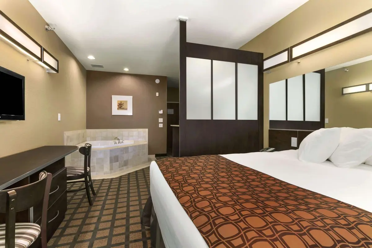 Private in-room jacuzzi tub at Microtel Inn & Suites by Wyndham Minot