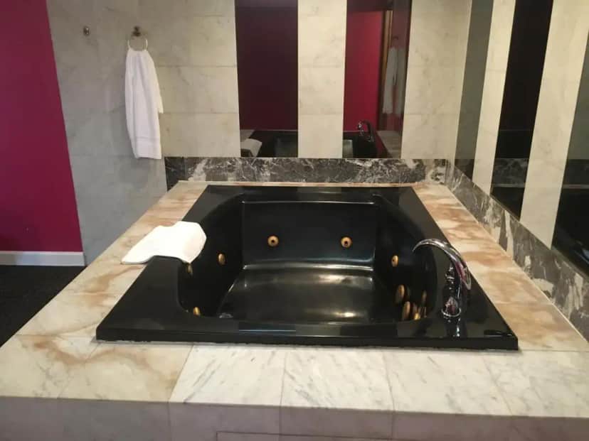 a black sink in a bathroom with a counter at Midway Inn & Suites in Oak Lawn