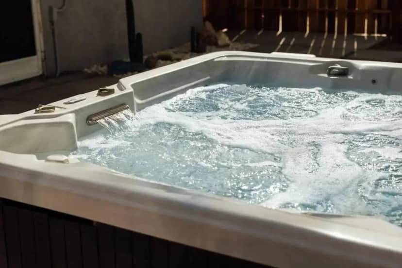 a jacuzzi tub with water pouring into it at Modern Sunset in Yucca Valley