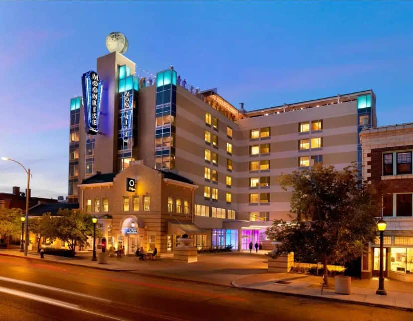 a building on a city street at night at The Moonrise Hotel in Saint Louis