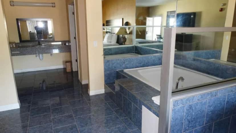 Private in-room jacuzzi tub in the King Suite with Spa Bath - Non-Smoking at Motel 6 Houston, TX – Willowbrook Mall