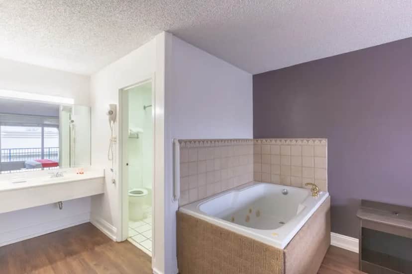 Private in-room jacuzzi tub in the Premium Room, 1 King Bed, Jetted Tub at OYO Hotel Baton Rouge – Mead Rd
