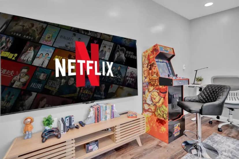 a living room with a desk and a chair