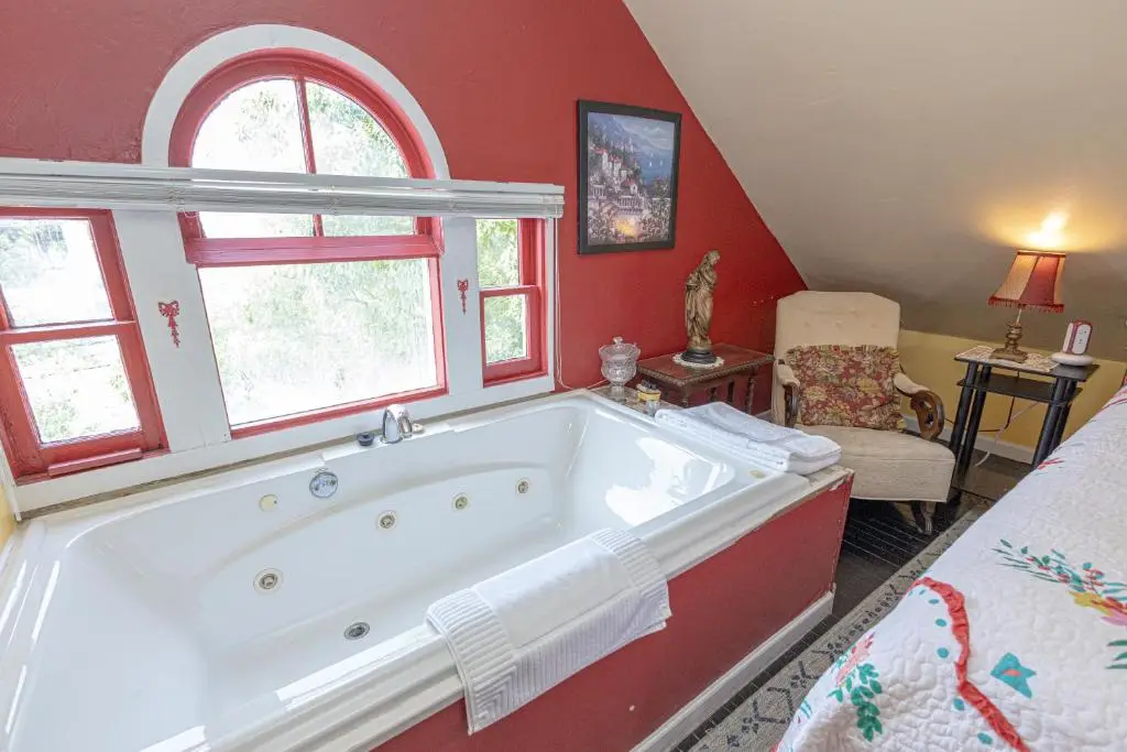 Private in-room jacuzzi tub in the King Suite with Balcony and Spa Bath - Attic at Penny Farthing Inn