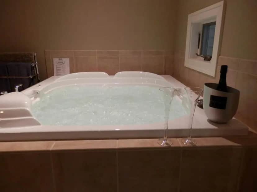 Private in-room jacuzzi tub in the King Suite with Spa Bath - Anniversary Suite at Pigeon Creek Inn