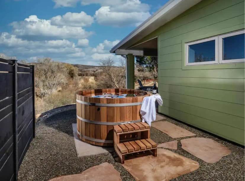 a hot tub sitting on the side of a house at Pitchner Place Hot Tub Under the Stars Creek Tr in Cornville
