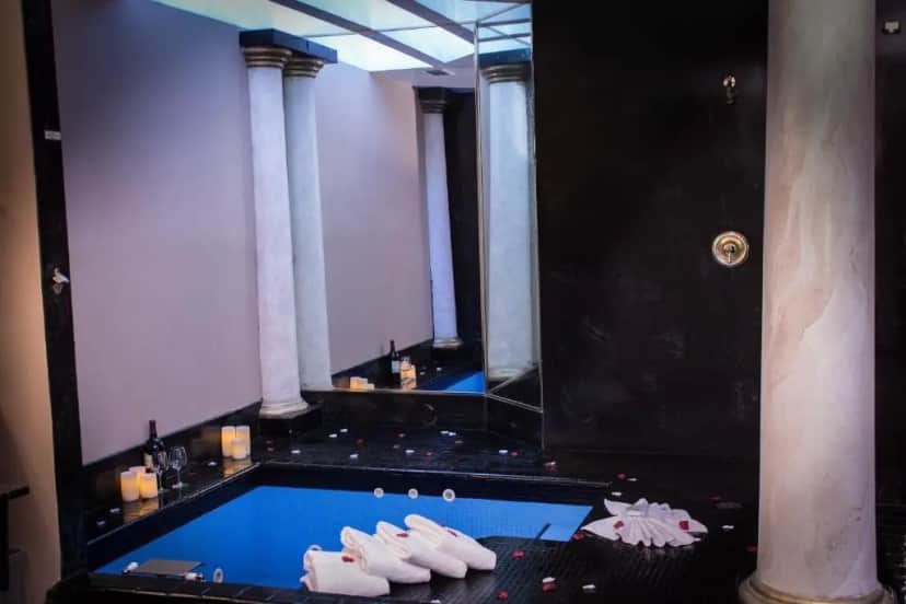 Private in-room jacuzzi in the Honeymoon Suite at Postmarc Hotel and Spa Suites