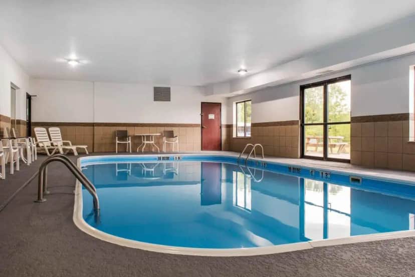a pool in a hotel room with a large pool at Quality Inn & Suites Anderson I-69 in Anderson