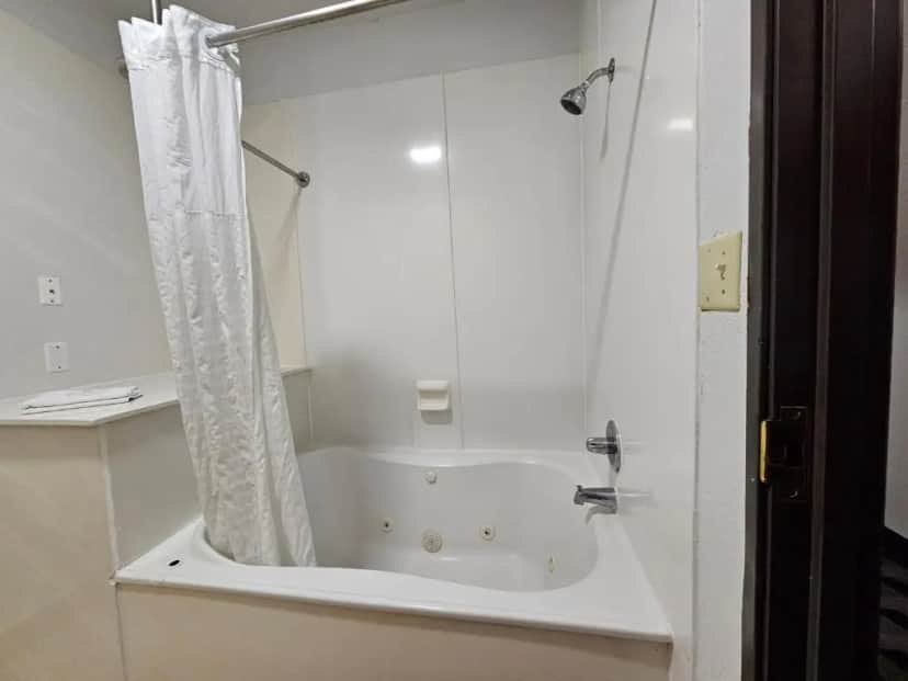Private in-room jacuzzi tub in the King Suite with Whirlpool Bath - Accessible/Non-Smoking at Quality Inn & Suites DFW Airport South
