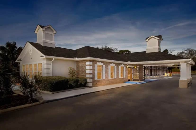 a large house with a driveway at Quality Inn & Suites Lexington in Lexington