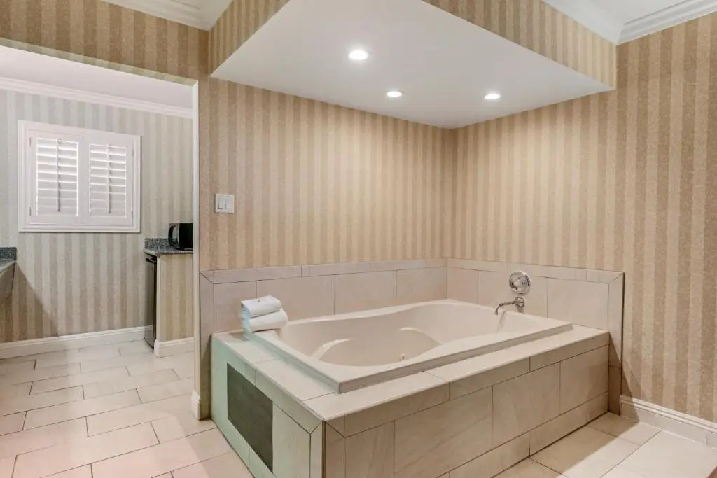 Private in-room jacuzzi tub in the Deluxe Room, 1 King Bed, In-Room Hot Tub, Non Smoking at Quality Inn & Suites Maingate