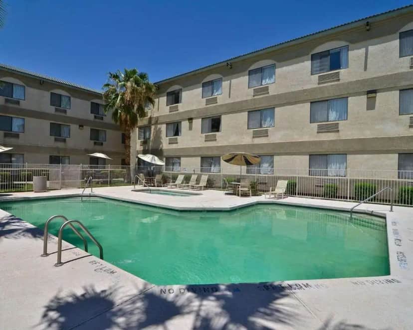 a large swimming pool in front of a building at Quality Inn & Suites Yuma in Yuma